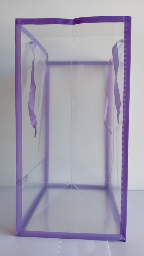 ساک دستی طلقی دسته پانچی با بند روبانی در 6 رنگ ابعاد 25*18*35 cm کناره